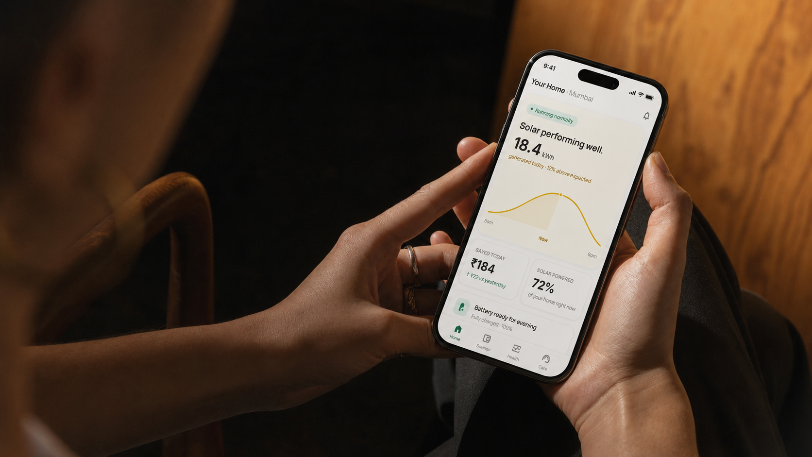 Arka mobile app shown on a phone held in warm ambient light