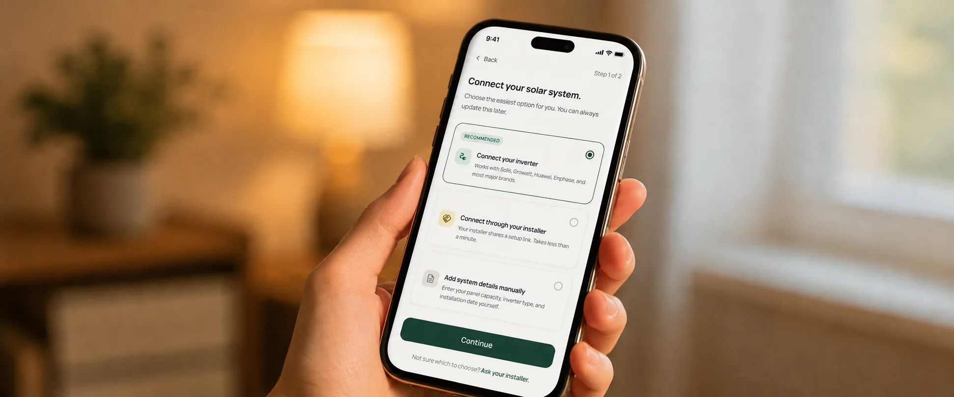 Arka app connection screen shown on a phone held in warm ambient light