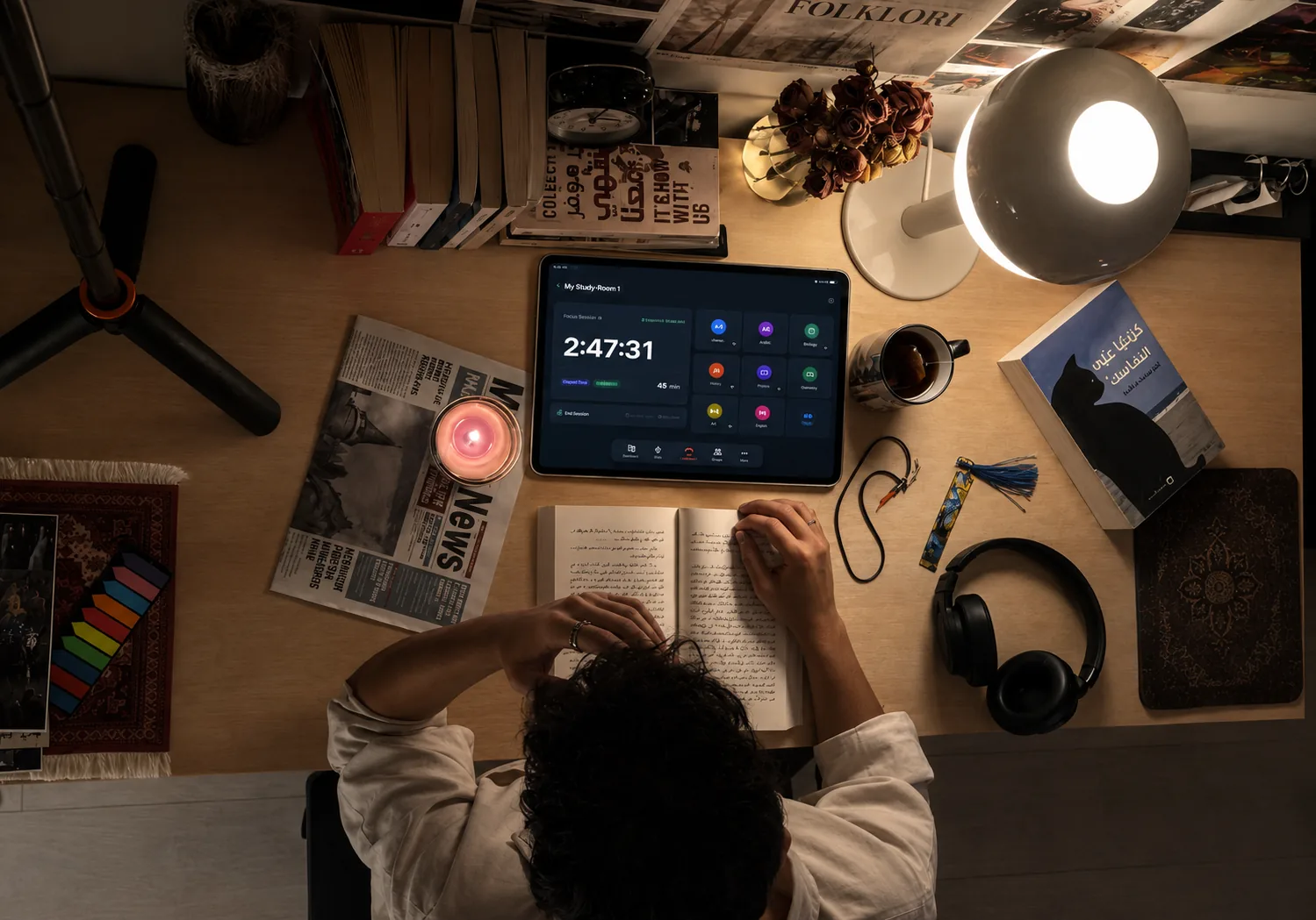 Nest study room interface shown on a tablet in a real study desk environment.
